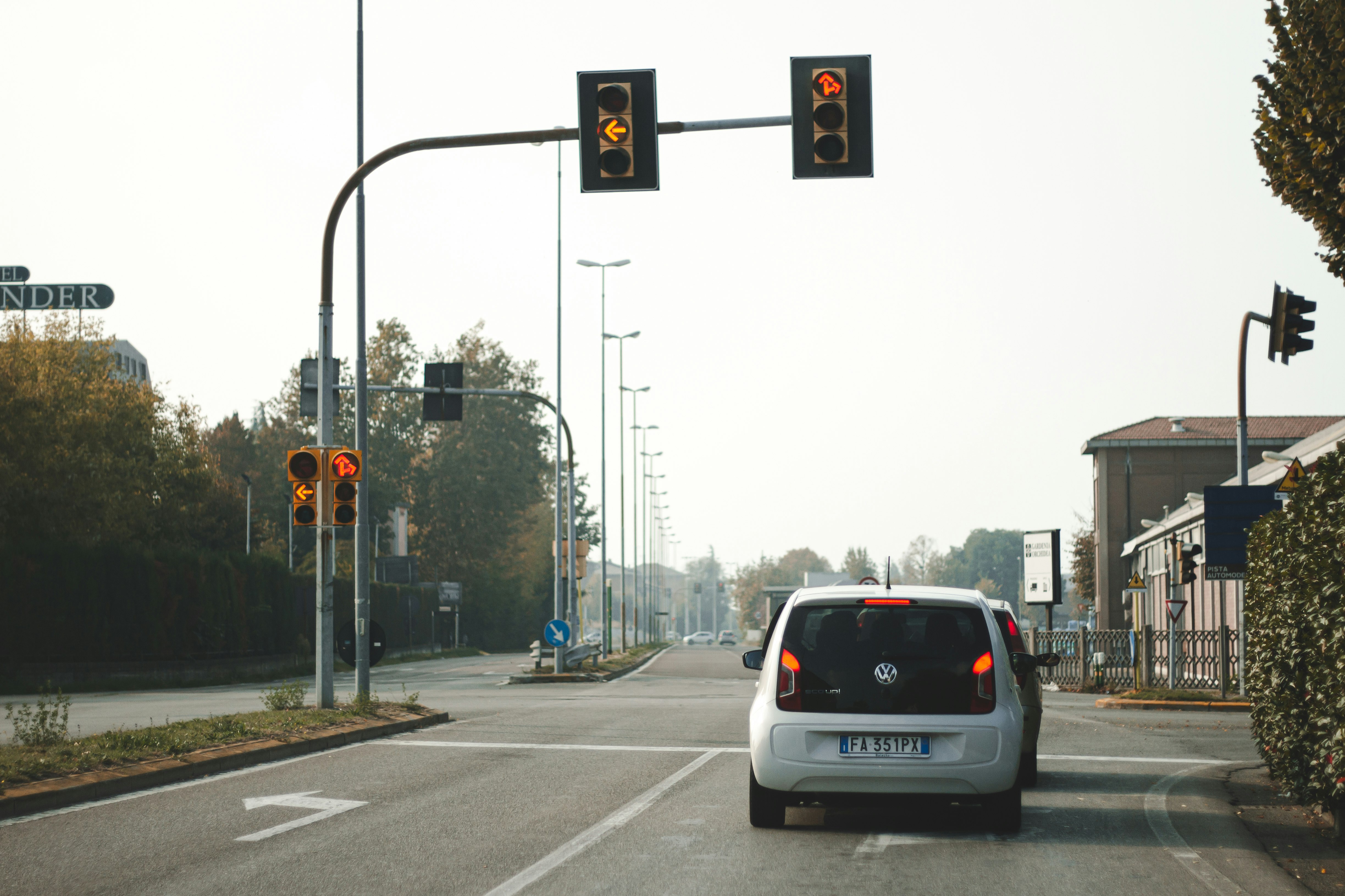 white suv on road during daytime